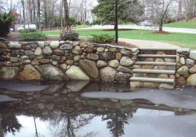 New 'dry wall' and limestone treads, from driveway to entry walk. The wall also serves as a retaining wall 
